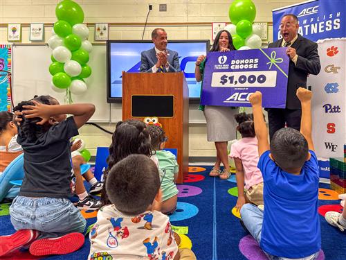  students and principal celebrate their renovated room